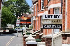 street with 2 to let signs outside terraced houses