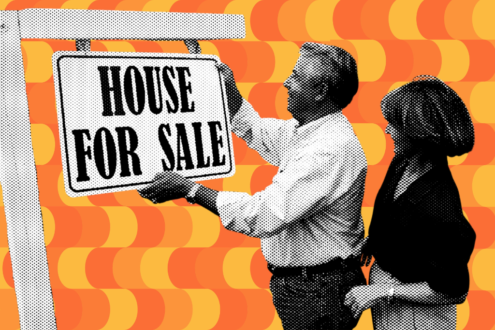 Man and woman holding up a for sale sign